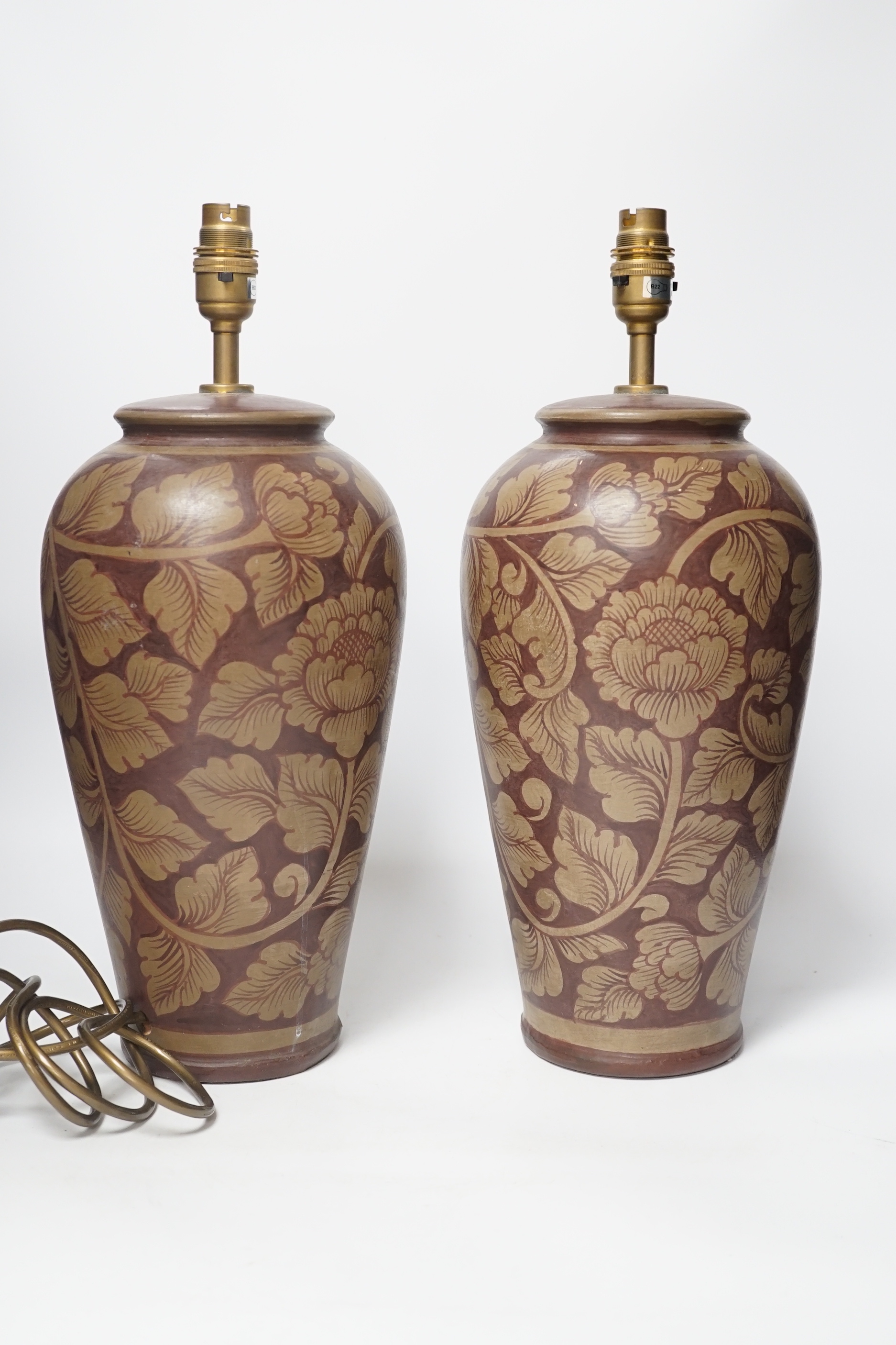 A pair of modern pottery floral designed lamps, total height 42cm